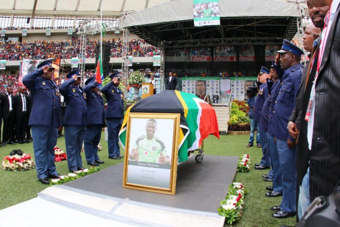 Senzo Meyiwa's coffin arrives during the funeral service of the late Senzo Meyiwa (South African and Orlando Pirates captain) at Moses Mabhida Stadium on November 01, 2014 in Durban, South Africa. Senzo Meyiwa was shot dead in Vosloorus on the East Rand last Sunday, October 26, 2014. (Photo by Anesh Debiky/Gallo Images/Getty Images)